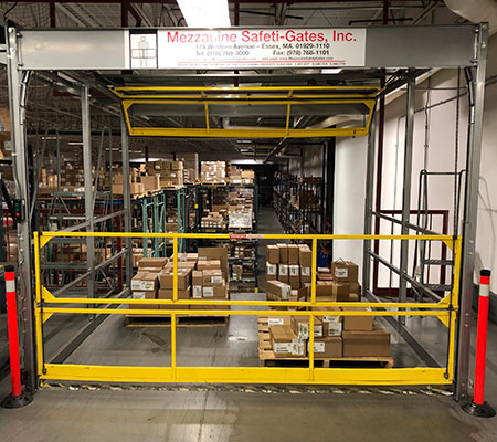Rolled overhead mezzanine gate loaded with pallets